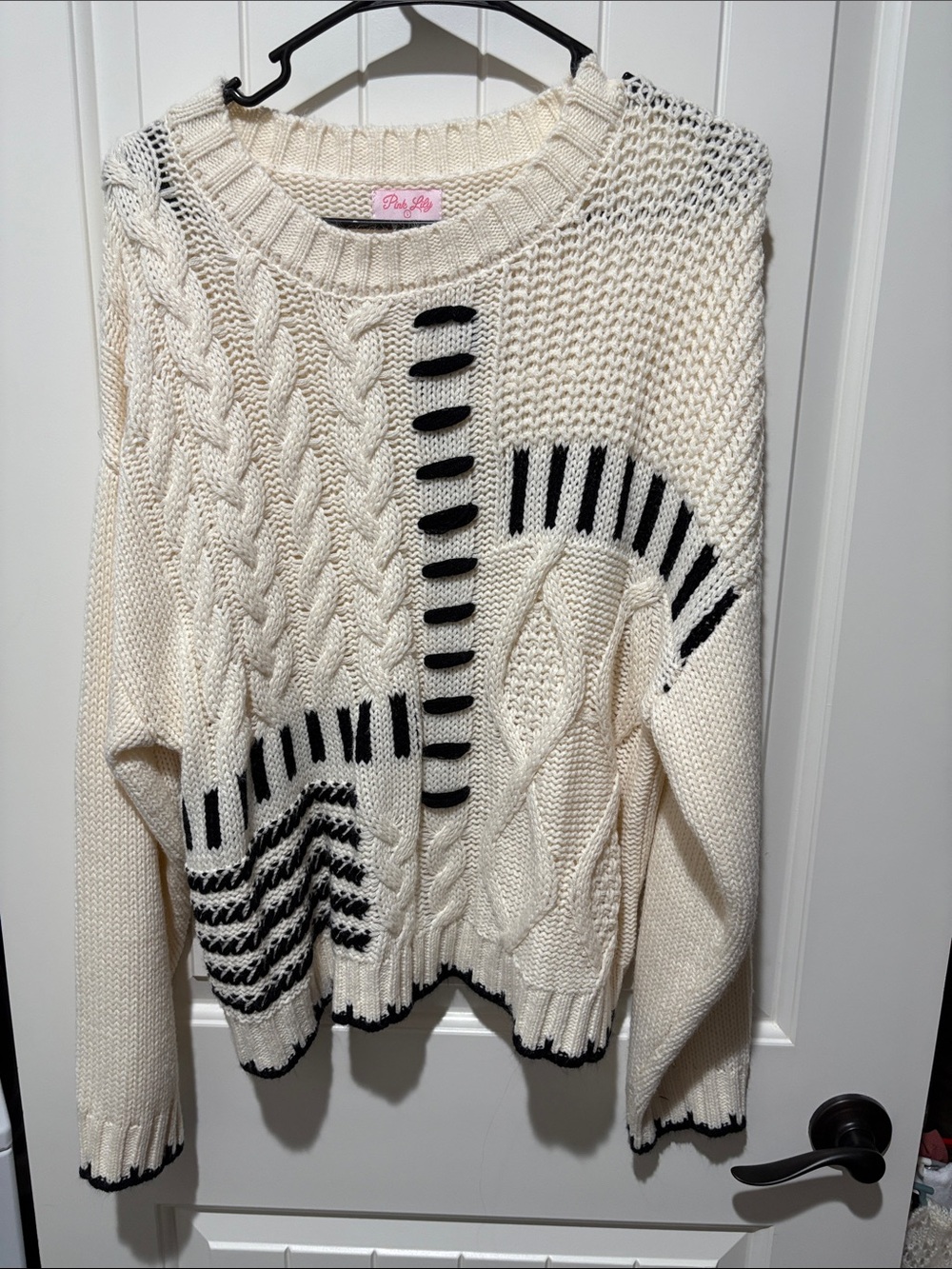 Pink Lily Cream Sweater with Black Graphic Accents